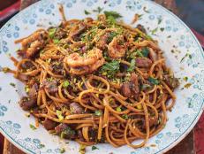 Inspired by my time cooking with Nonna Rosanna, this sweet and sour pasta is an absolute joy, and uses prawns and their heads for maximum flavour. I'm using her trick of washing sliced onions to make them milder, and that moisture also helps to add extra sweetness as they cook, before we add vinegar for contrast.