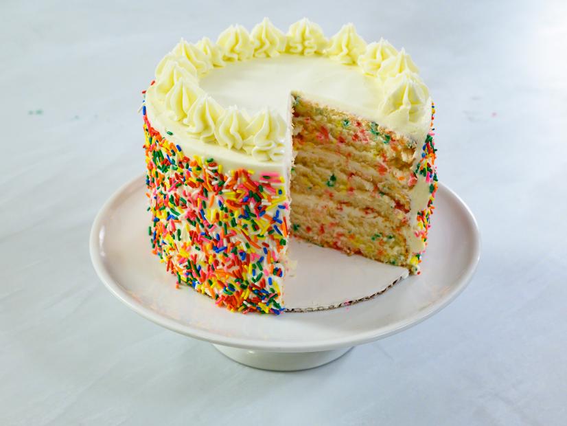 Rainbow sprinkle confetti cake with vanilla buttercream, as seen on Food Network Kitchen Live.