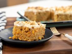 My sister, Morgan, prefers carrot cake bars to a traditional layer cake. She wants each and every bite to have an equal ratio of cake to frosting, and after trying it, I agree. However, we differ on our opinion of nuts. She is a no nuts in carrot cake girl, whereas I love the texture and toasted flavor and think they balance out the sweetness. I decided to take the nuts out of the batter and add them to the top of the frosting, so that we can both be satisfied. Sprinkled nuts also camouflage a multitude of frosting imperfections and add simple decoration to the top. I double the walnuts on one half and leave them off of the other, making this one recipe perfect for both of us.