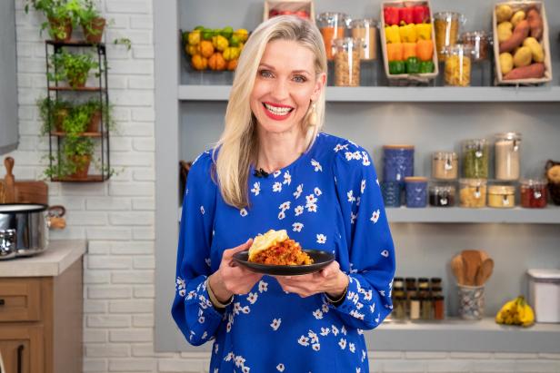 Catherine McCord posing with Slow Cooker 12 Layer Lasagna, as seen on Food Network Kitchen Live.