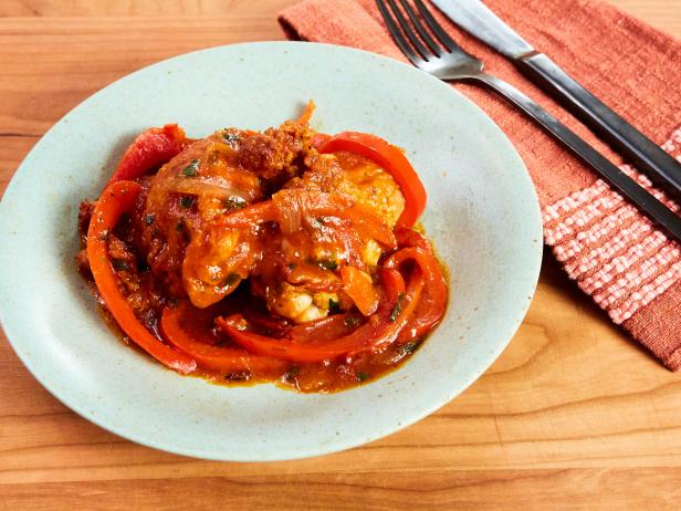 Braised Chicken Thighs With Tomatoes Peppers And Onions Recipe Michael Symon Food Network