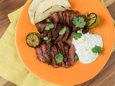 Hanger Steak Tacos with Cilantro-Lime Crema and Charred Limes