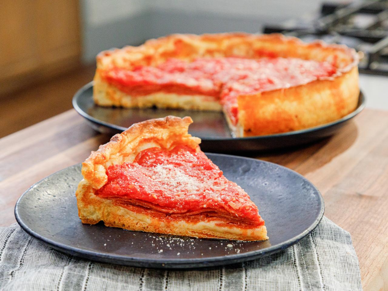 https://food.fnr.sndimg.com/content/dam/images/food/plus/fullset/2020/03/19/0/FNP_Mauro-Chicago-Style-Deep-Dish-Pizza-Into_s4x3.jpg.rend.hgtvcom.1280.960.suffix/1584645771183.jpeg