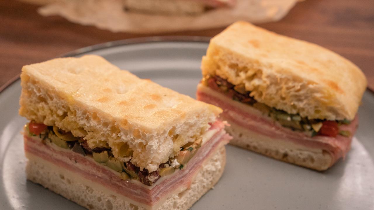 https://food.fnr.sndimg.com/content/dam/images/food/plus/fullset/2020/05/29/0/FNP_Bertinelli_Pressed-Italian-Picnic-Sandwich.JPG.rend.hgtvcom.1280.720.suffix/1591628051271.jpeg