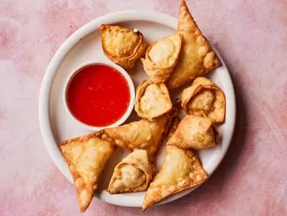 Description: Jet Tila's Crab Rangoon. Keywords: Crabmeat, Cream Cheese, Scallions, Tarragon, Wonton, Egg, Sweet Chili.