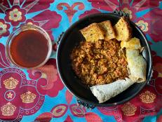 Kitfo is the ultimate celebration dish in Ethiopia. The spiced raw beef was an important part of my wedding feast, but it is also served after a long vegetable fast. It can be refined, as it is here, but at its simplest, kitfo is simply chunks of raw beef dipped in the spicy dip called awase. We serve several versions of kitfo at Rooster. This one reminds me a little of the English bookmaker sandwich--the one made with roast beef, mustard, and horseradish. You can use the awase as a dip for vegetables, as a sauce for grilled fish, or as a rub for rack of lamb. There are a lot of versions of spiced butter in Ethiopia. My version is true to that made by my wife Maya's tribe, the Gurage. It has a hint of funk, like the funk of fermented foods, the new wave of flavor to follow umami.