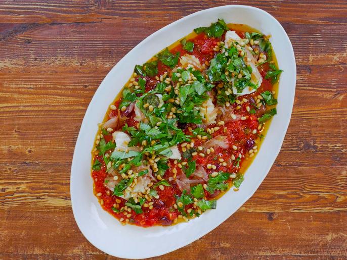 Olive Oil Poached Cod With Tomato Sauce Pine Nuts And Herbs Recipe Antonia Lofaso Food Network