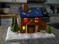 This is a classic gingerbread house dough that's designed for construction. Made with vegetable shortening (which has a higher melting point than traditional butter) and no leavening, the dough holds its shape well once baked. It's strong and sturdy enough to make a basic gingerbread house, an advanced mansion or even additional elements for your house.