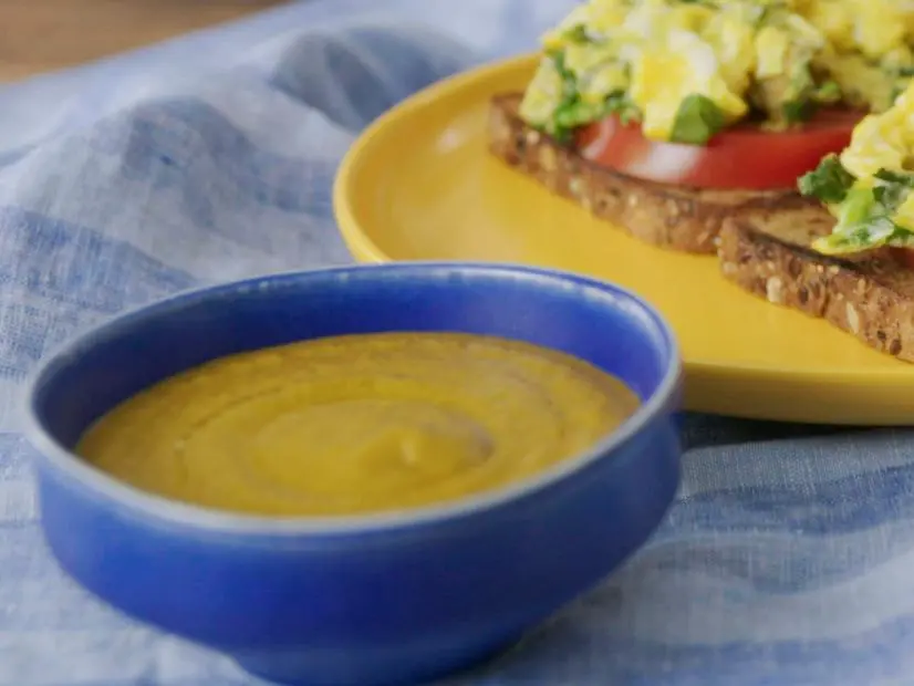 Host Hawa Hassan displays her Herbed Egg Breakfast Toast with Hot Pepper Sauce at home, as seen on Food Network Kitchen's Hawa at Home