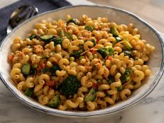 No mayo alert! This pasta salad takes inspiration from spring rolls with edamame, carrots, and bell peppers. The dressing is a savory combination of miso, ginger, soy, and sesame. This salad gets better as it sits, making it perfect for picnics.