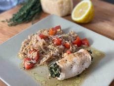 A sumptuous stuffing of spinach and soft goat cheese, jeweled with sun-dried tomatoes and basil, is all it takes to turn plain ol&rsquo; chicken breast into a magnificent craveable main. It pairs perfectly with the lemon-thyme orzo pilaf for a meal that is colorful, elegant, and satisfying.