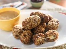 Revamp your leftover stuffing into this delicious and decadent appetizer. Each is a perfect warm crispy bite of stuffing with a cheesy surprise in the middle!