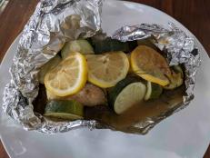 A foil-wrapped "bake and serve" dinner is like a small, sealed envelope that allows the chicken to steam in its own flavorful juices. It requires very little fat for cooking and the flavors are very clean. The packets can be assembled in advance and cooked just before serving. In this recipe, we focus on a tasty kicked-up teriyaki sauce to bring the chicken and vegetables to life. I make these in the morning and store them in the fridge. There's nothing like getting home after a long day and just baking and serving dinner!
