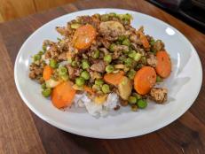 I based this on a Cantonese dish my dad would make when I was growing up. He would take hours chopping, dicing and slicing and then throw it all into a boiling hot wok and dinner would be served within two minutes. I think he loved the cinema of this type of cooking. I miss him and the dish so much that I came up with a simplified weeknight version of it. Don't like spicy food? Simply omit the red pepper flakes. Serve this with bowls of steamed rice.