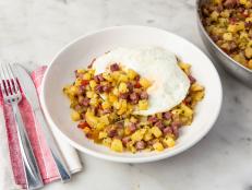 When I was growing up, it was always a special treat to have a can of corned beef hash for breakfast. This is the same idea, but much better than whipping out the can opener and serving up a bowl of Mary Kitchen! If you're not a spicy pepper person, use a bell pepper instead, but I like adding pickled cherry peppers to my hash--just thinking about them makes my mouth water. Then toss in some fried onions and potatoes, and you'll have a dish that pretty much scratches any and all brunch itches. Salty, sweet, greasy, and spicy . . . mmmmm!!!
