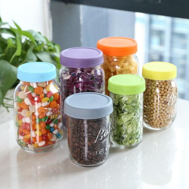 https://food.fnr.sndimg.com/content/dam/images/food/products/2019/4/16/rx_aozita-colored-plastic-mason-jar-lids-.jpeg.rend.hgtvcom.616.616.suffix/1555445508365.jpeg