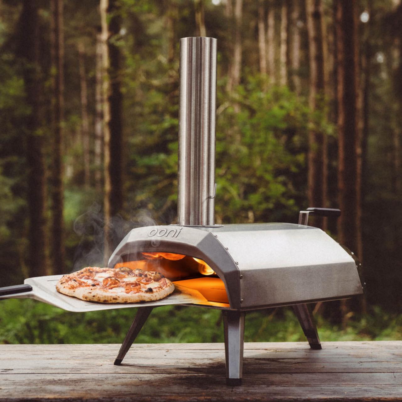 https://food.fnr.sndimg.com/content/dam/images/food/products/2020/5/13/rx_ooni-karu-wood-charcoal-fired-portable-pizza-oven.jpeg.rend.hgtvcom.1280.1280.suffix/1589384618893.jpeg