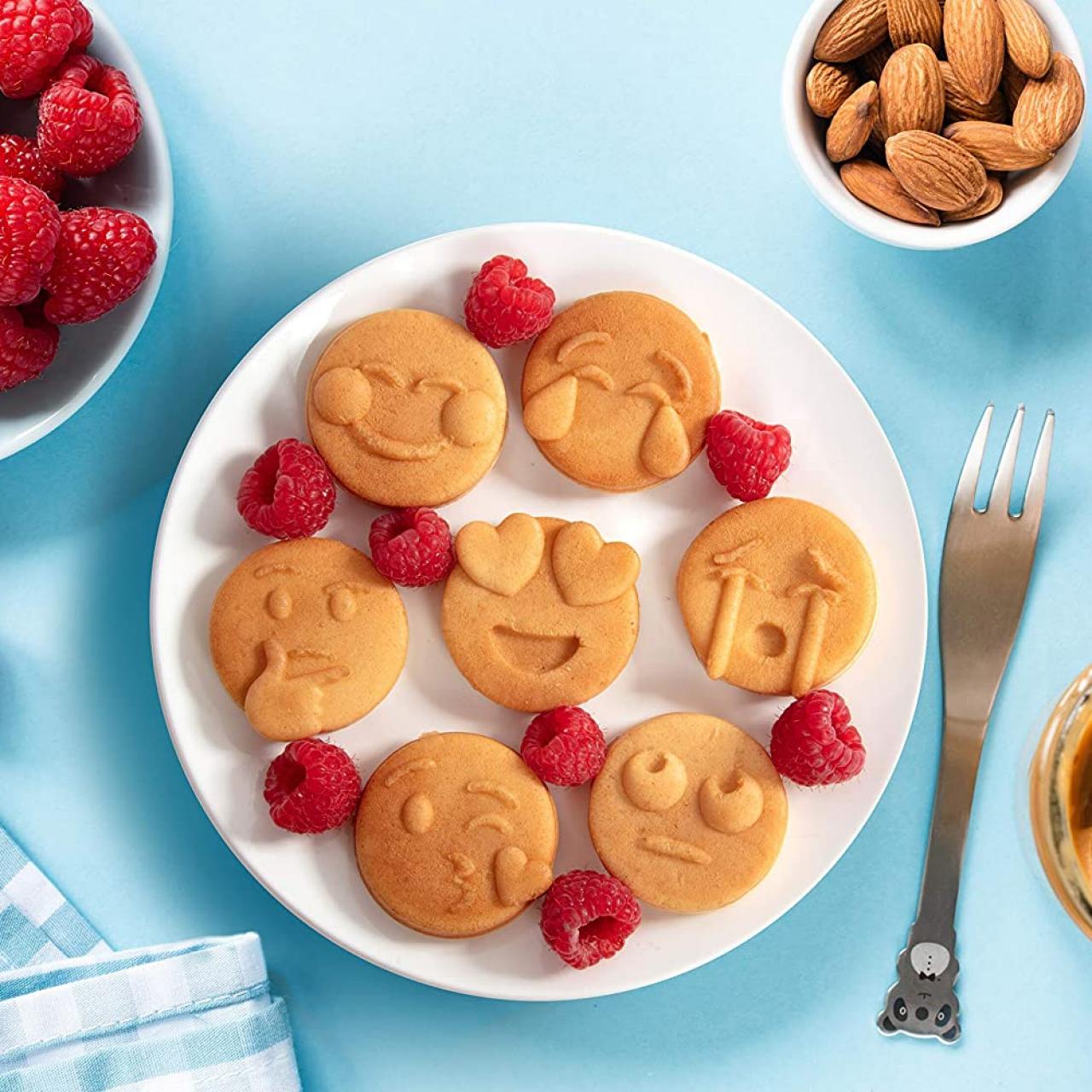 https://food.fnr.sndimg.com/content/dam/images/food/products/2021/2/12/rx_mini-emojis-smiley-faces-waffle-maker.jpeg.rend.hgtvcom.1280.1280.suffix/1613144766648.jpeg