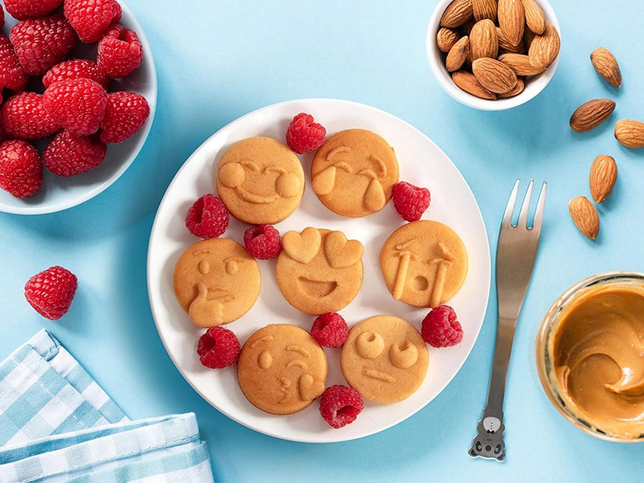 https://food.fnr.sndimg.com/content/dam/images/food/products/2021/2/12/rx_mini-emojis-smiley-faces-waffle-maker.jpeg.rend.hgtvcom.1280.960.suffix/1613144766648.jpeg
