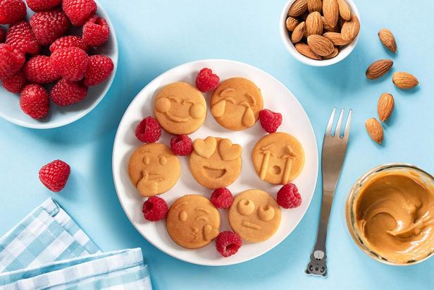 https://food.fnr.sndimg.com/content/dam/images/food/products/2021/2/12/rx_mini-emojis-smiley-faces-waffle-maker.jpeg.rend.hgtvcom.616.411.suffix/1613144766648.jpeg