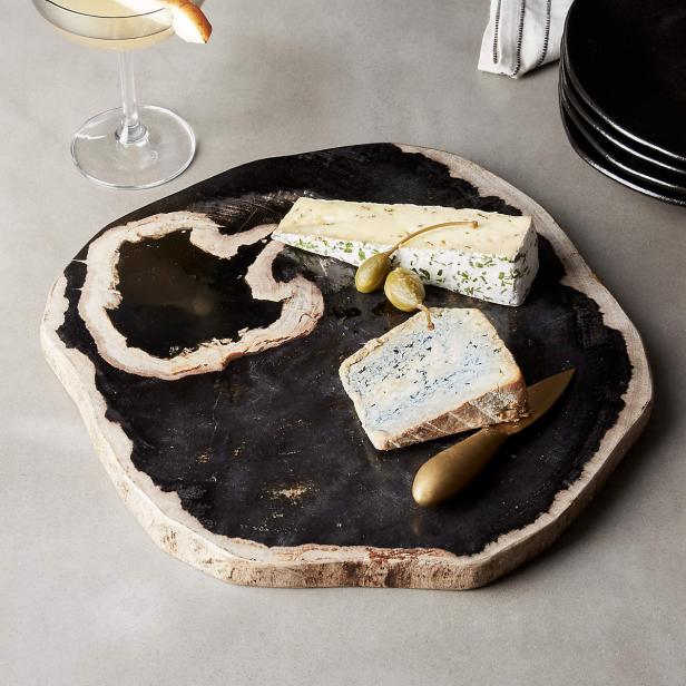 https://food.fnr.sndimg.com/content/dam/images/food/products/2022/10/25/rx_ring-petrified-wood-serving-board.jpeg.rend.hgtvcom.616.616.suffix/1666724073096.jpeg