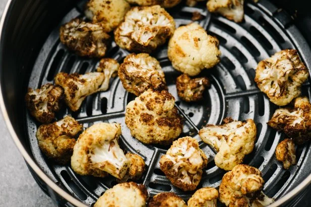 Closeup of golden cauliflower in an air-fryer in Frederick, MD, United States