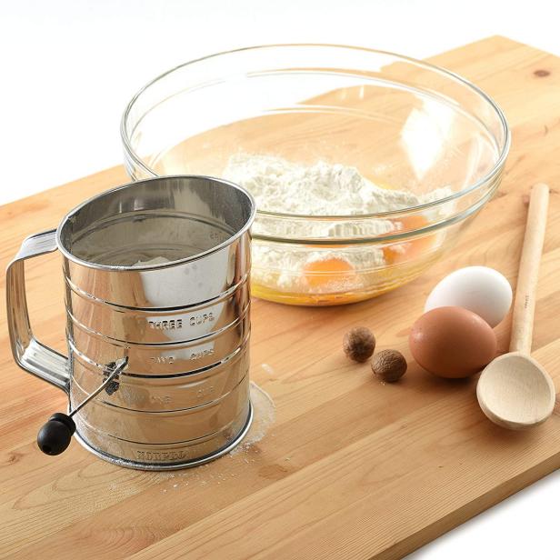 https://food.fnr.sndimg.com/content/dam/images/food/products/2022/2/18/rx_norpro-3-cup-stainless-steel-rotary-hand-crank-flour-sifter.jpeg.rend.hgtvcom.616.616.suffix/1645197858146.jpeg