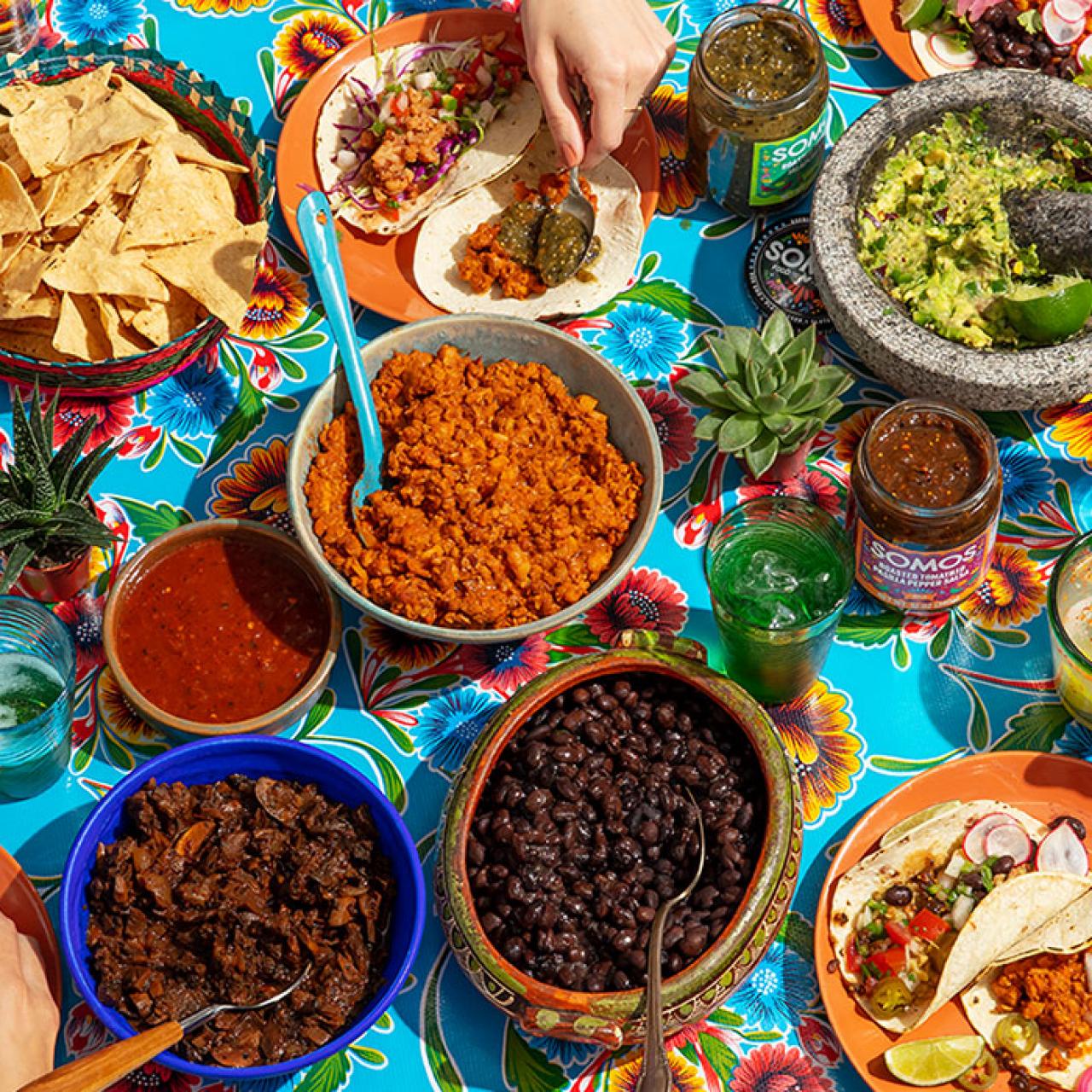 https://food.fnr.sndimg.com/content/dam/images/food/products/2022/5/4/rx_somos-taco-party_s4x3.jpg.rend.hgtvcom.1280.1280.suffix/1651676716068.jpeg