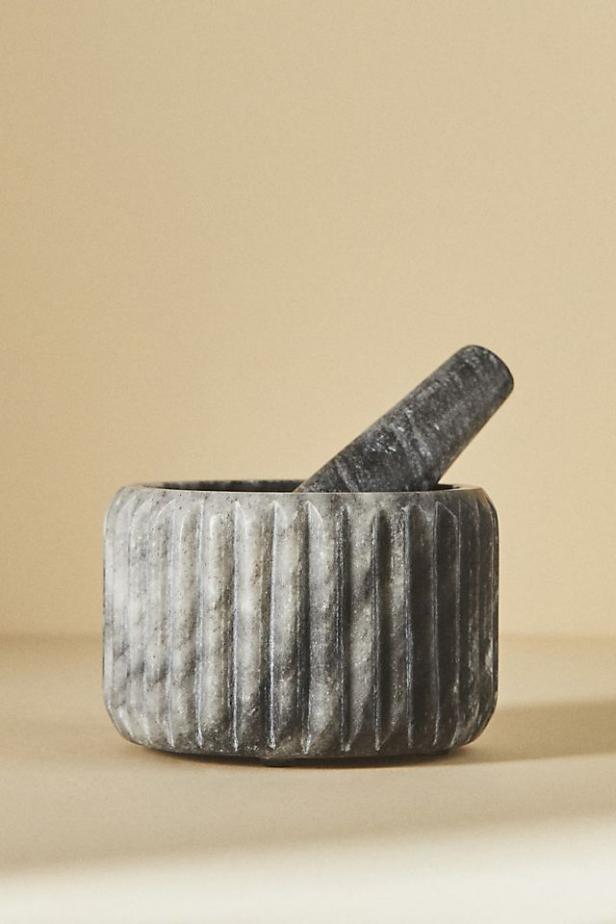 https://food.fnr.sndimg.com/content/dam/images/food/products/2023/10/24/rx_anthropologie_marble-mortar-and-pestle-set.jpeg.rend.hgtvcom.616.924.suffix/1698170641982.jpeg