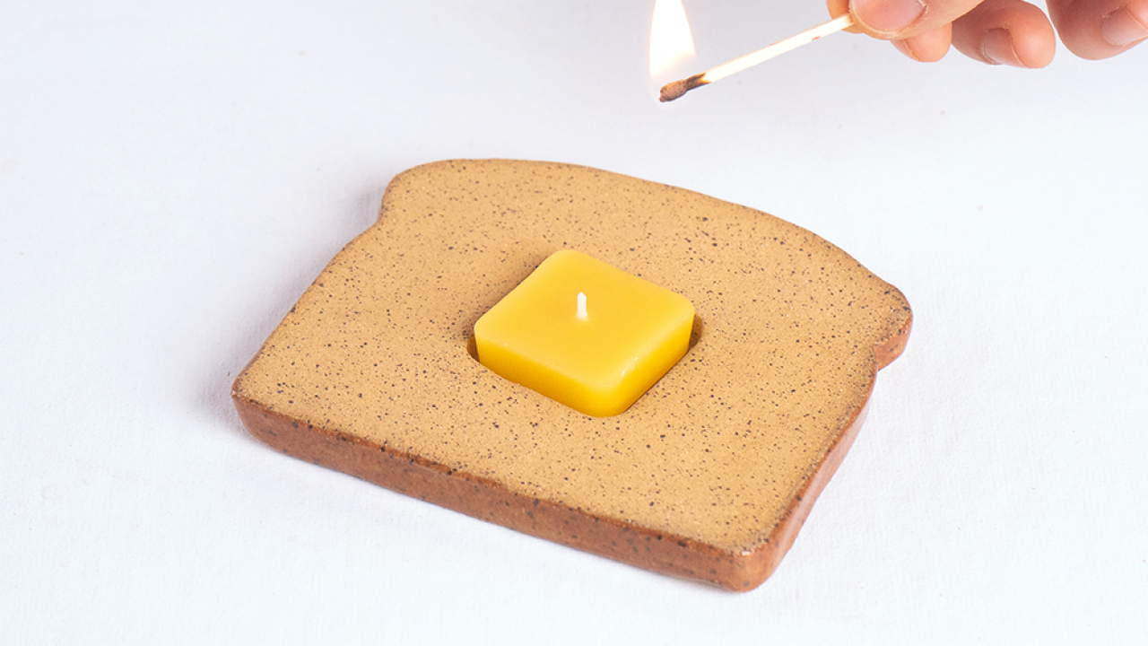 https://food.fnr.sndimg.com/content/dam/images/food/products/2023/11/15/rx_ceramic-toast-candle.png.rend.hgtvcom.1280.720.suffix/1700062744443.png