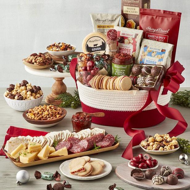 https://food.fnr.sndimg.com/content/dam/images/food/products/2023/12/1/rx_seasons-best-snack-gift-basket.jpeg.rend.hgtvcom.616.616.suffix/1701452979947.jpeg