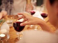 Friends having late dinner and wine at restaurant