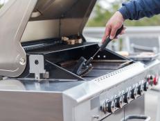 Cleaning outdoor gas grill before next grilling.