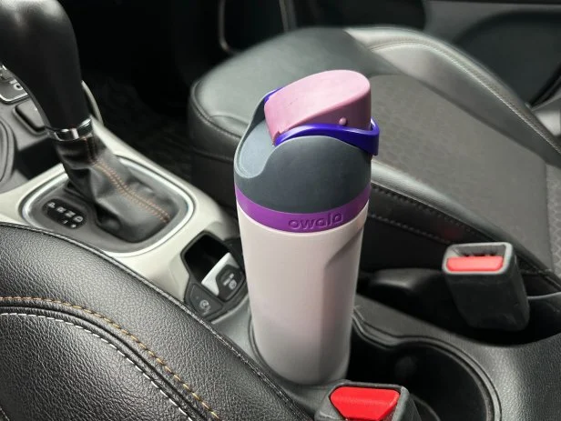 Owala water bottle in a cup holder