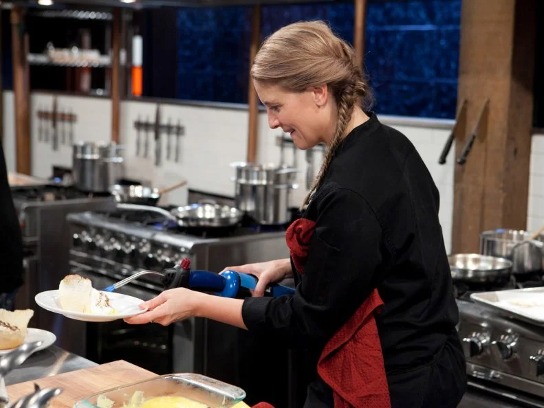 Chopped: After Hours chef Amanda Freitag working on her dessert that must include: vanilla pudding cups, wafer sheets, lemon soda and a torch, as seen on Food Network's Chopped: After Hours.