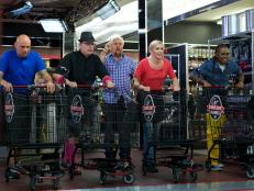 Host Guy Fieri with chefs Shane Miller, Daniel Vercher, Kristina White, and Quiana Jeffries during the start of the shopping part of Game 1, Can Can, Italian Feast, 30 min time limit, as seen on Food Network's Guy's Grocery Games, Season 1.