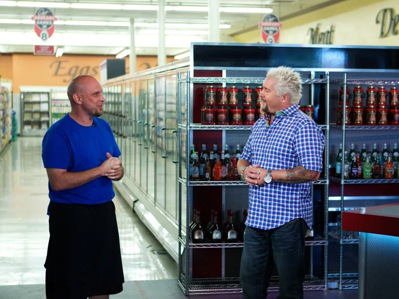 Host Guy Fieri with chef Shane Miller, Game 3, Grocery List, Best Rice Dish, 35 min time limit, during the judging, as seen on Food Network's Guy's Grocery Games, Season 1.