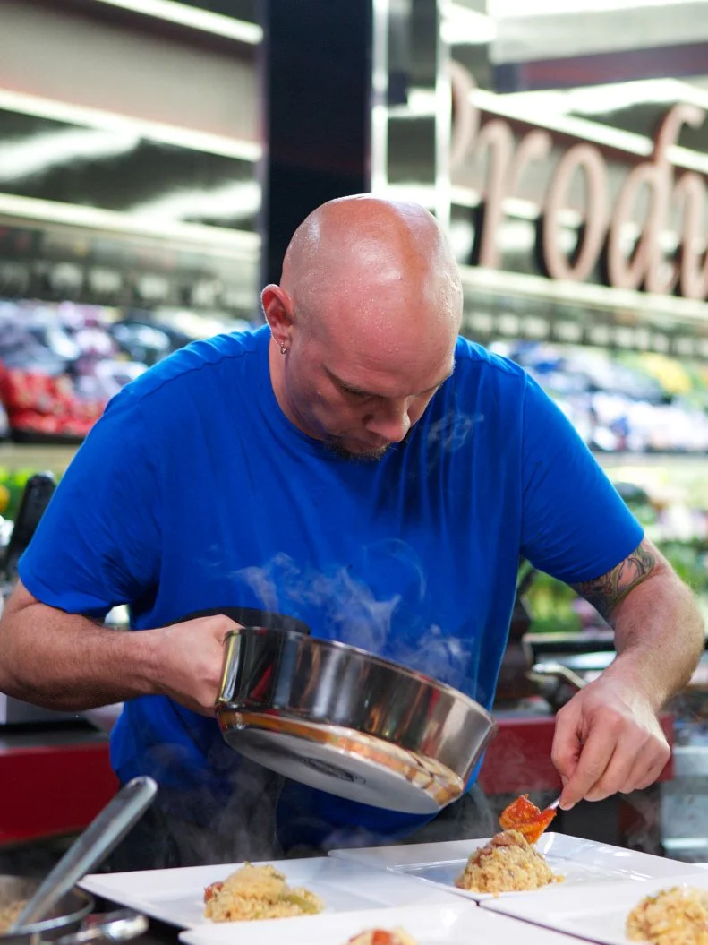 Chef Shane Miller during the cooking part of Game 3, Grocery List, Best Rice Dish, 35 min time limit, as seen on Food Network's Guy's Grocery Games, Season 1.