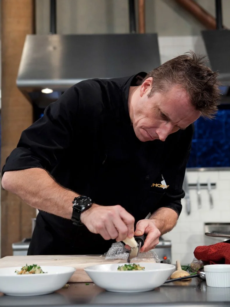 Chopped: After Hours chef Marc Murphy works on his appetizer that must include: pickled pigs feet, butter beans, coleslaw mix and sweet potato chips, as seen on Food Network's Chopped: After Hours.