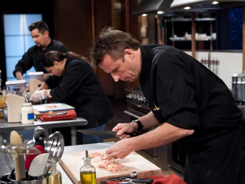 Chopped: After Hours chefs: Aaron Sanchez, Maneet Chauhan and Marc Murphy working on their appetizer that must include: pickled pigs feet, butter beans, coleslaw mix and sweet potato chips, as seen on Food Network's Chopped: After Hours.