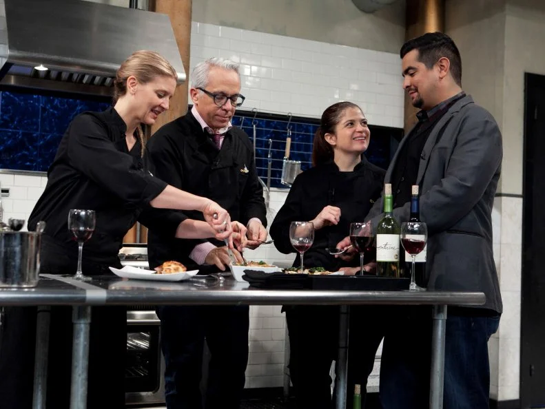 Chopped: After Hours host Aaron Sanchez talks with chefs Alex Guarnaschelli, Geoffrey Zakarian and Amanda Freitag about their entrees that must have included: deep dish pizza dough, rabbit escabeche, swiss chard and pineapple cheese spread, as seen on Food Network's Chopped: After Hours.