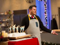 David Bondarchuck describes his Yule Log creation during the Great Holiday Cake-Over main heat challenge as seen on Food Networkâ  s Holiday Baking Championship,Season 1
