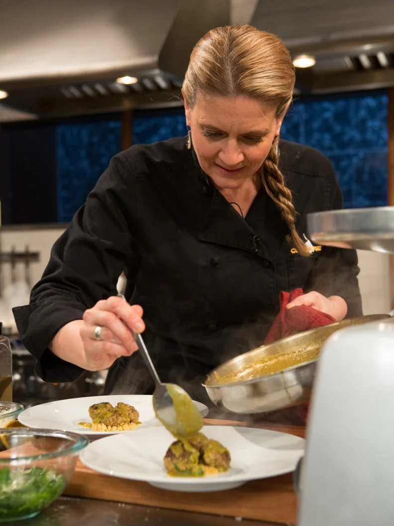 Chef Amanda Freitag works on her dish that must include: lamb shank, ginger, baby leeks and creme brulee, as seen on Food Network's Chopped After Hours, Season 22.
