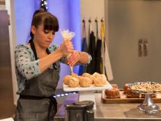 Erin Cambell putting the final touches on her dishes during the Day and Night main heat challenge as seen on Food Networkâ  s Holiday Baking Championship,