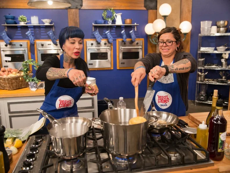 Contestants Danielle Ruiz and Amber Brauner cook as seen on Food Networkâ  s Worst Cooksin America, Season 5.