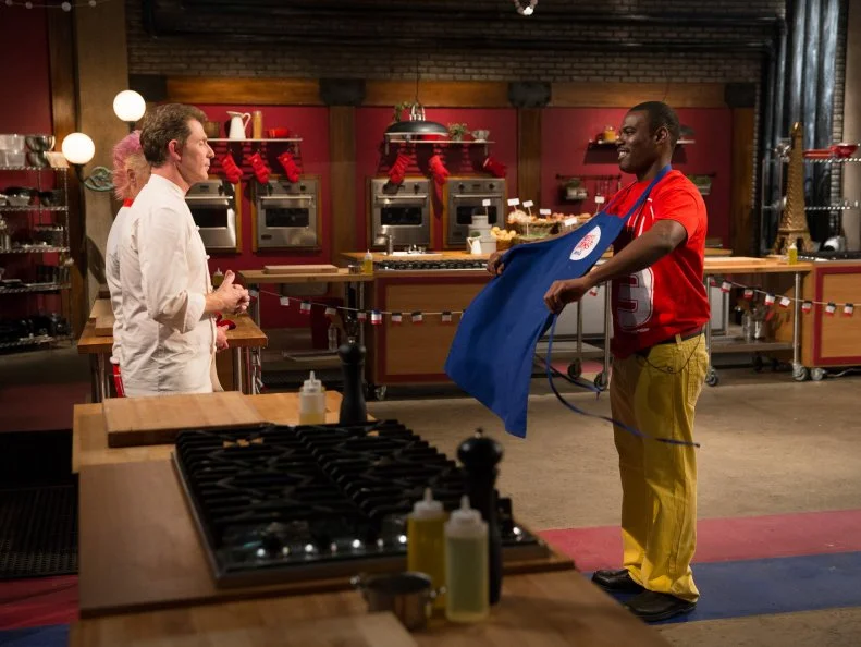 Hosts Bobby Flay and Anne Burrell watch as contestant Lance Greene leaves after being from the competition as seen on Food Networkâ  s Worst Cooksin America, Season 5.