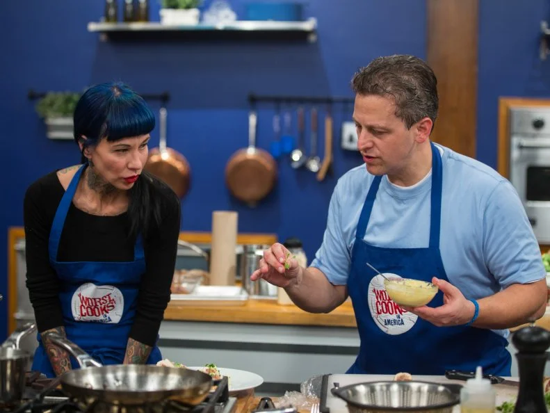 Amber Brauner and Daniel Beyda cook during the Roulade Challenge as seen on Food Network's Worst Cooks in America, Season 5.
