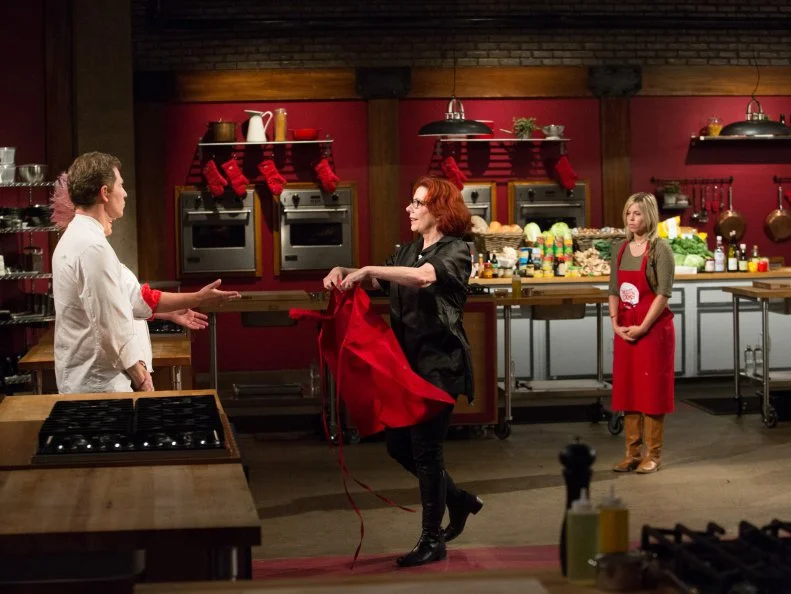 Red Team member Carol Holder is during the Surprise Party Challenge. The Red Team recruits are Jamie Thomas, Carie Pullano-Keller, Mike Glazer and Carol Holder, as seen on Food Network's Worst Cooks in America, Season 5.