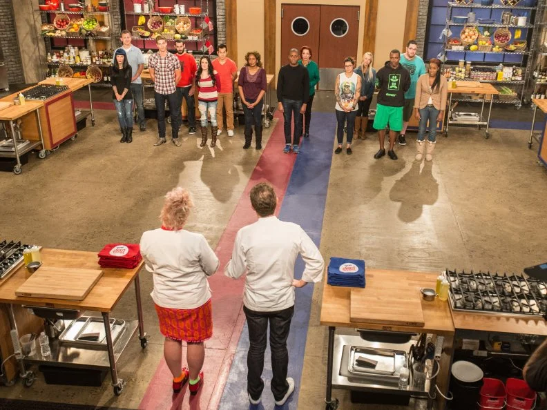 The cast stand in front of Bobby Flay and Anne Burrell as seen on Food Networkâ  s Worst Cooksin America, Season 5.
