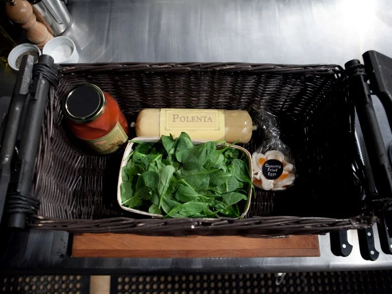 The mystery basket ingredients for the appetizer round are: pickled pig lips, polenta, spinach and gummy eggs, as seen on Networkâ  s Chopped, Season 19.